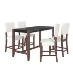 Ensemble de salle à manger 5 pièces comprenant une table de bar haute, une table de bar en faux marbre et 4 chaises à assise rembourrée.